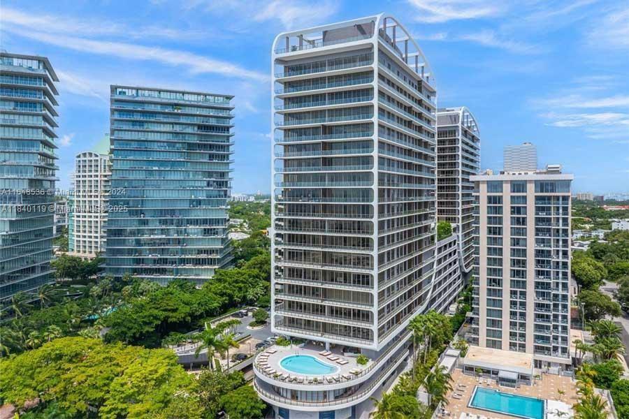 Experience the pinnacle of luxury living at the newly constructed Mr. C Residences in Coconut Grove, designed by Ignazio and Maggio Cipriani. This elegant 2-bedroom, 2-bathroom residence features soaring 10-ft ceilings, floor-to-ceiling windows, porcelain tile flooring, terrazzo and quartz countertops, custom Italian cabinetry, and Wolf and Sub-Zero appliances. Enjoy a private outdoor terrace and access to resort-style amenities, including a rooftop pool, bar, and lounge, a garden-level pool with cabanas, a spa, fitness center, concierge reception, butler service, valet, and housekeeping. Nearby dining, retail, and a gourmet market complete this unparalleled lifestyle.