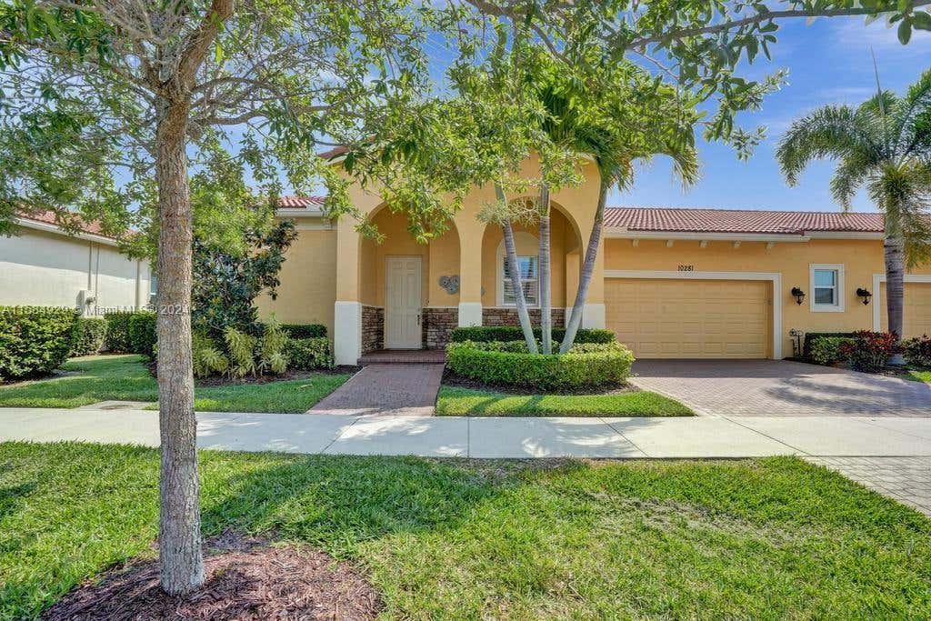 Photo of 10281 SW Reggiani Rd, Port Saint Lucie, FL 34986 (MLS # A11584929)