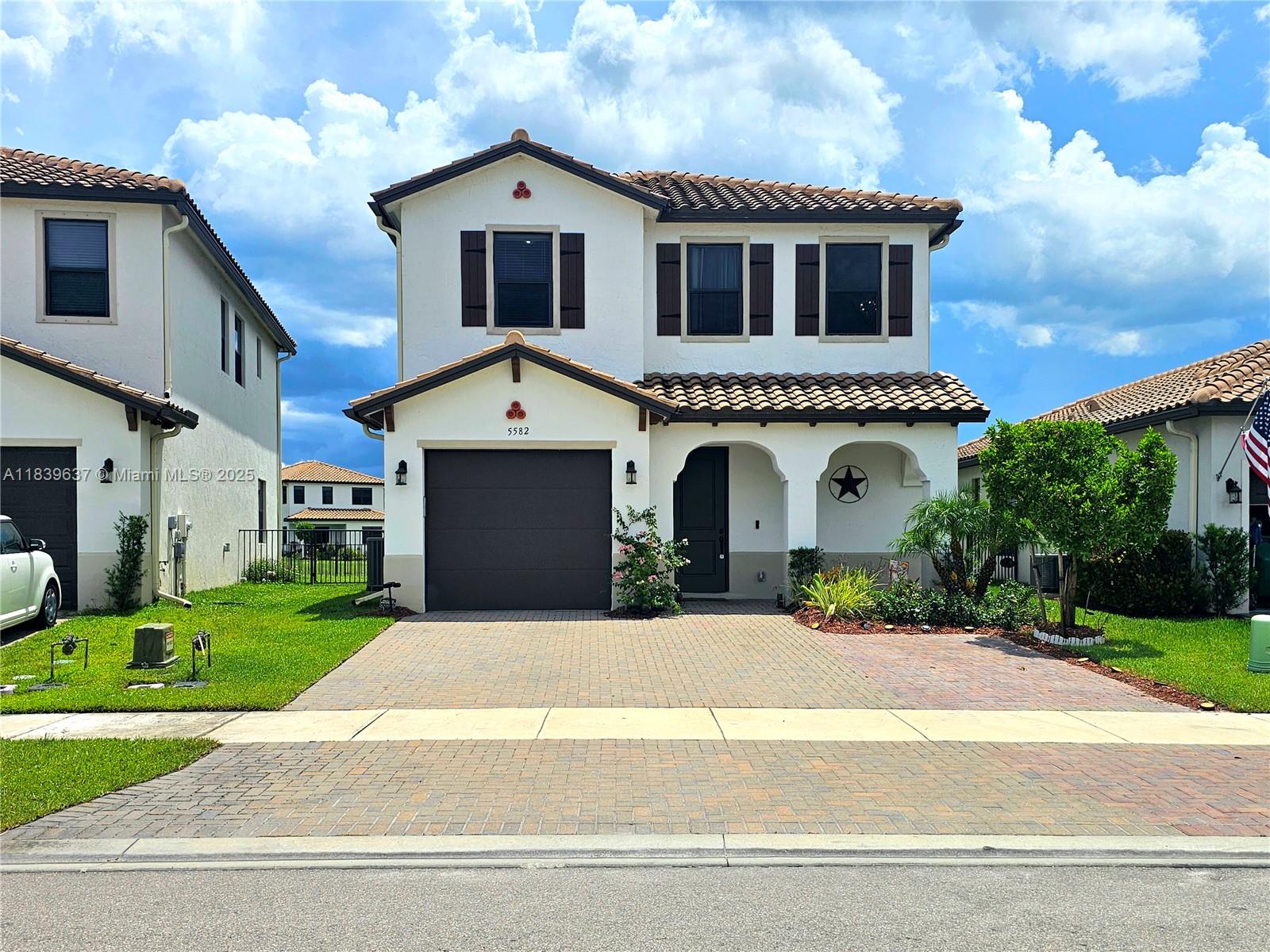 Upgraded Balboa model in Ave Maria with 3 bedrooms, 2.5 baths, and 1,900+ sq. ft. on a lakefront lot with sunset views. Features impact-resistant windows, wood plank tile downstairs, luxuryvinyl upstairs, and a modern staircase with metal handrail and silver balusters. Open kitchen with granite counters, stainless steel appliances, and updated lighting. Luxury laminate flooring, custom lighting, and smart recessed hi-hats. Outdoors: extended pavers, screened lanai, oversized driveway, and fenced backyard with floodlights and a safety bar to prevent small dogs from escaping. Located in Maple Ridge with clubhouse, resort pool, fitness center, courts, playgrounds, trails, waterpark, parks, sports fields. Nearby Publix, restaurants, medical offices, & schools including Ave Maria University.