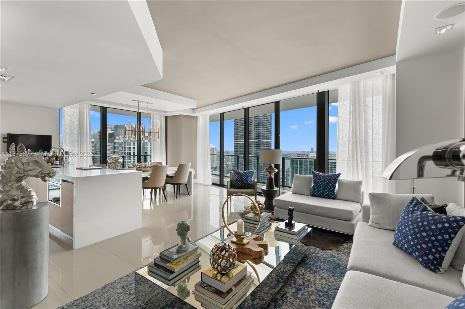 READY TO BE BLOWN AWAY? Where on Brickell today can you find a large, spacious, corner, high floor, ALL glass apartment. Almost 1900 sq feet of indoor / outdoor space. With an 80 foot wrap around terrace. Breathtaking water & city views in all directions. With incredible quality upgrades & finishes. MINT! Complete with the most tasteful high end designer furniture. NOT just an apartment, but a real home! In a luxury 54 story tower in the dead center of Brickell. Full amenities & hotel services. Pools, gym, spa, restaurants, 24hrs front desk and security. Parking, lounges, etc. Why not have THE very best at a very fair price!