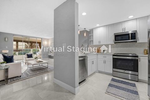 Photo of 7100 NW 17th St #305, Plantation, FL 33313 (MLS # A12017511)