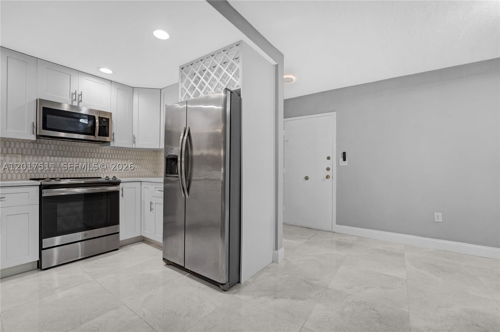 Photo of 7100 NW 17th St #305, Plantation, FL 33313 (MLS # A12017511)
