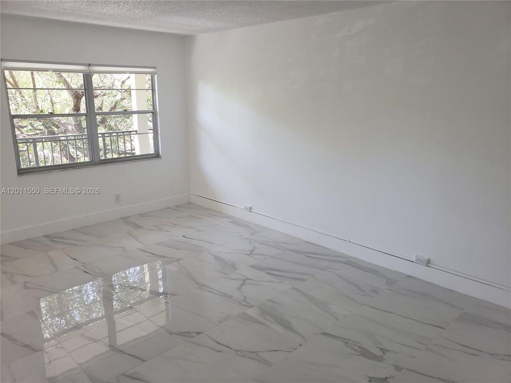 Photo of 13255 SW 7th Ct #305D, Pembroke Pines, FL 33027 (MLS # A12011550)