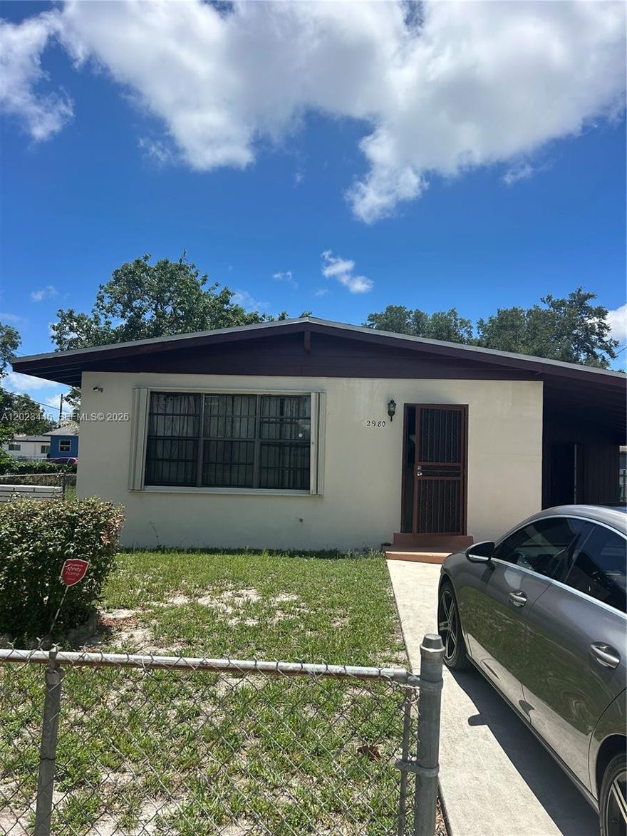 Fantastic area, great lot, room for expansion. Perfect home for first home buyers, or investors. 
New accordion shutters, roof is approx 10 years old, good condition. Original terrazzo flooring and ceramic tile. Vaulted living room/dining room ceiling.  New fixtures in the bathroom. New electrical box, outside storage and laundry hookup, carport and additional parking in the driveway, sold as is. Text listing agent for additional info and appointments