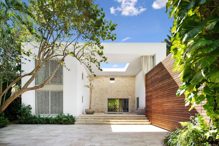 Designed by world renowned architect Chad Oppenheim, Villa Allegra is a stunning tropical modern home on Sunset Island III, one of the most coveted gated communities on Miami Beach. Nestled on a 14,000 sqft waterfront lot, the property features lush landscapes by Raymond Jungles. The 6,000 sqft interior features volume ceilings, six bedrooms, seven baths, and a home theater. Seamlessly connecting to a poolside terrace, the home offers direct ocean access with 80 feet of water frontage. Outdoors, multiple docks accommodate water toys and yachts. Crafted with luxurious materials, including stucco, concrete, Ipe wood, and onyx, this contemporary oasis embodies the perfect blend of luxury and tranquility.