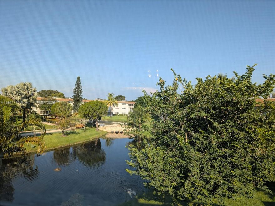 *** $5,000 towards Buyer's closing cost *** Serene lake & fountain views from this bright 2BR/2BA top-floor condo in Hawaiian Gardens—Nettle Gardens Phase Vl (55+ community). Over 20K upgrade in Hurricane Impact windows throughout plus 2023 A/C & water heater provide comfort and peace of mind. The easy flow split bedroom plan includes a roomy living/dining area, efficient kitchen, and a glass-enclosed Florida room to enjoy the water views year-round. Elevator building with common laundry and extra storage. Resort-style amenities: heated pool, clubhouse, fitness room, billiards, shuffleboard & pétanque; cable/internet included in dues. Convenient Lauderdale Lakes location close to shopping, dining, beaches & major roads. Move right in or update to taste—excellent value at this price point.