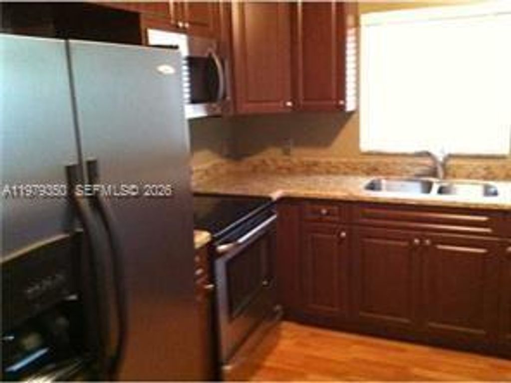 Photo of 806 Maplewood Dr, Green Acres, FL 33415 (MLS # A11979350)