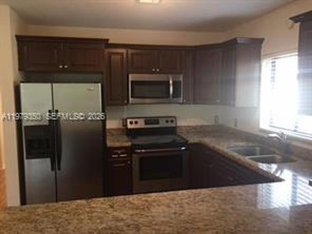 Photo of 806 Maplewood Dr, Green Acres, FL 33415 (MLS # A11979350)