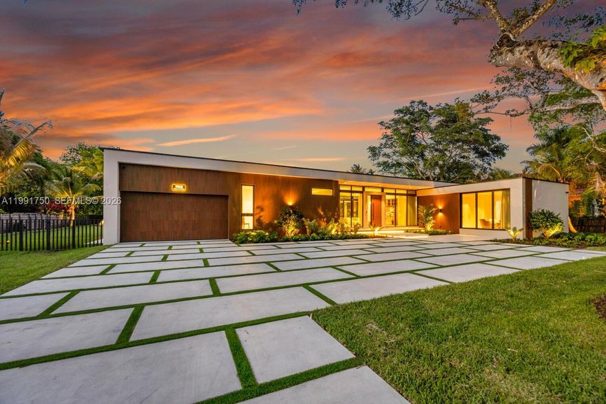 Introducing Casa Pinecrest, a striking modern estate in one of Pinecrest’s most coveted neighborhoods, set behind gates on a sprawling 37,853 sqft lot. Designed for elevated living and effortless entertaining, this residence offers a 6 bedroom, 6.5 bathroom main home plus a detached VIP suite and private gym, creating a true resort style compound with exceptional privacy.

Every detail reflects exceptional craftsmanship, from custom millwork and museum finish baseboards to refined interior doors by MiaCucina. The main kitchen by Febal Casa is a showpiece, featuring Taj Mahal quartzite countertops, top of the line SubZero and Miele appliances, and an oversized pantry. A separate chef’s kitchen adds functionality, ideal for entertaining or catering.

Refined finishes continue throughout with 48x48 minimal white natural travertine flooring, expansive open living areas filled with natural light, and floor to ceiling glass enhancing the indoor outdoor flow. A statement powder room in emerald green stone and a spa inspired primary bath in Islimm Geo Crema complete the design. 

Outdoor living impresses with a heated pool, spa, summer kitchen, and expansive entertaining spaces. A full Control4 smart home system, electric blackout curtains, impact windows and doors, and a 2 car garage complete this turnkey estate in the heart of Pinecrest, offering a rare blend of design, scale, and functionality for today’s luxury buyer, with seamless indoor outdoor living throughout.