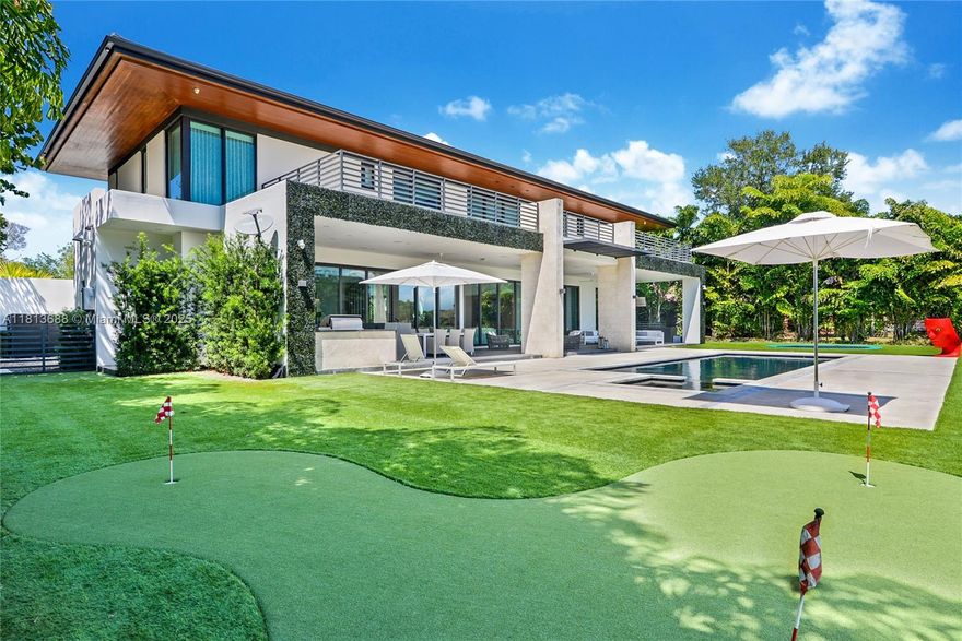 Tropical modern estate designed and built by famed architect Giorgio Balli. This 6BD/7.5BA home located in the private neighborhood of Loch Lomond Miami Lakes features all in-suite bathrooms, spectacular views of the Don Shula’s Golf Course from every room, state of the art smart home system with integrated lighting system, security surveillance system, custom built wine room, stunning summer kitchen, 2 laundry rooms, heated pool, in-ground trampoline, putting green, outdoor sauna, custom cold plunge, oversized garage and Chef’s kitchen with integrated appliances, gas range, and large marble kitchen island for entertaining. Property is surrounded by a private wall and secured by an electronic gate entrance. Truly one of kind with all of the amenities.