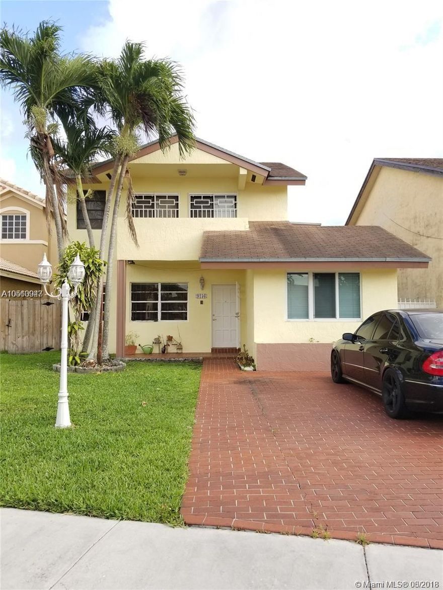 Fantastic 2 story 5 bedroom 4 Bathroom home on canal in Bilbao Estates. Located between Palmetto and Turnpike, centrally located to FIU, shopping, dining, etc. The first floor is tiled and features flow through floor-plan. Large living area perfect for entertaining, open layout, renovated kitchen with granite counter and new stainless steel appliances, AC, and laundry room with washer/dryer. Large family room with high ceilings and built-in bar leading to large outdoor area and atrium. Includes 2 bedrooms, and 2 full baths downstairs. Partially tiled yard has covered cabin area, storage room, and access to canal, and plenty of room for a pool. Second floor has laminate wood floors, two side by side bedrooms, plus spacious master bedroom with his/hers walk-in closets