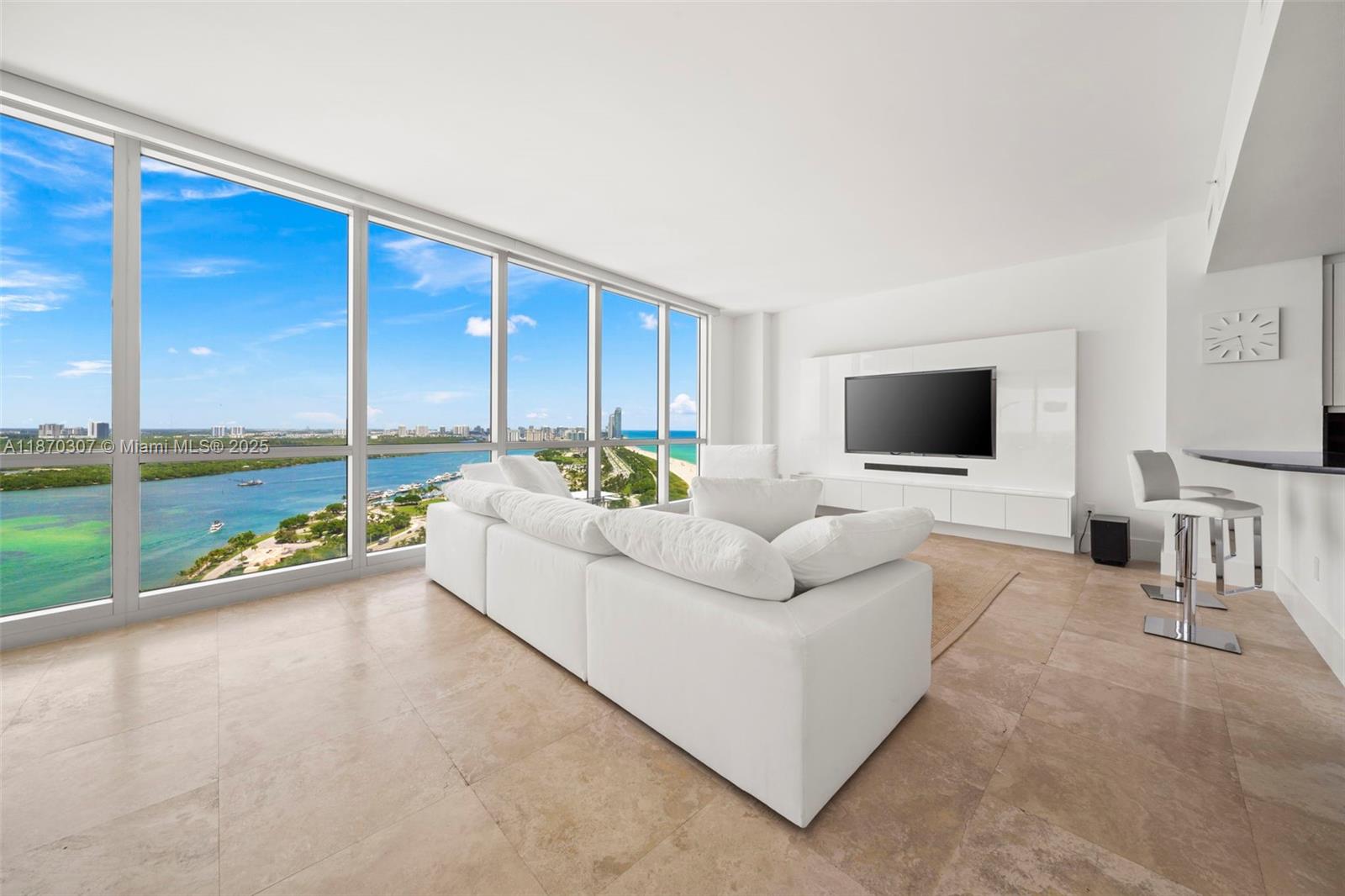 Stunning high-floor corner 2-bed, 2.5-bath residence with private elevator and floor-to-ceiling windows. Enjoy breathtaking unobstructed views of the intracoastal inlet, the ocean coastline, and the Miami skyline from an impressive terrace. Residence 2404, located one floor below the penthouses, features a state-of-the-art kitchen with Poggenpohl cabinetry, fully-appointed bathrooms featuring the finest fixtures. Residents enjoy full access to Ritz Carlton resort amenities such as ocean and poolside service and an on-site restaurant and spa. Located minutes from Miami Beach’s finest shopping and dining destinations.