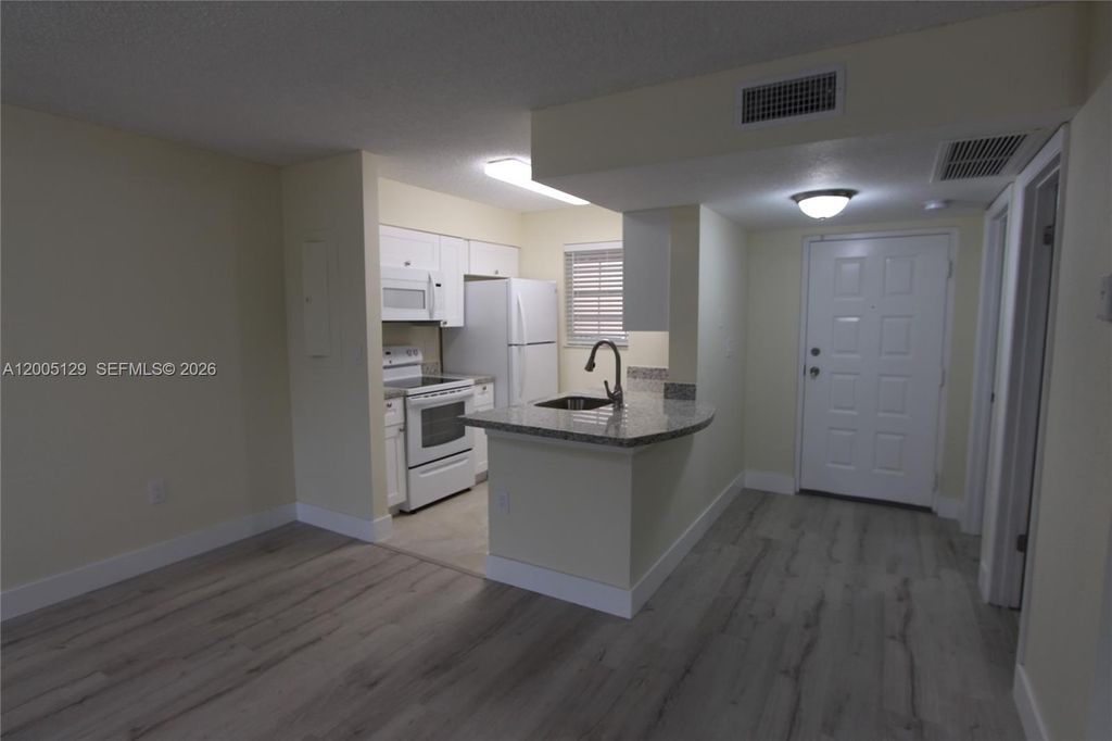 Photo of 2890 N Oakland Forest Dr #204, Oakland Park, FL 33309 (MLS # A12005129)