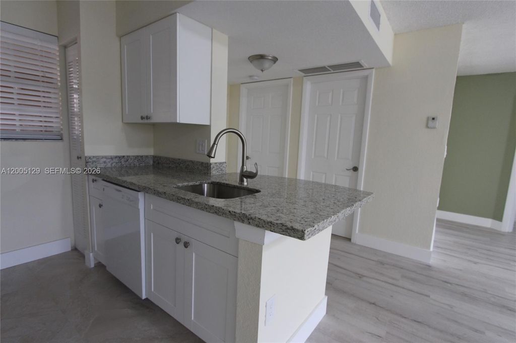 Photo of 2890 N Oakland Forest Dr #204, Oakland Park, FL 33309 (MLS # A12005129)