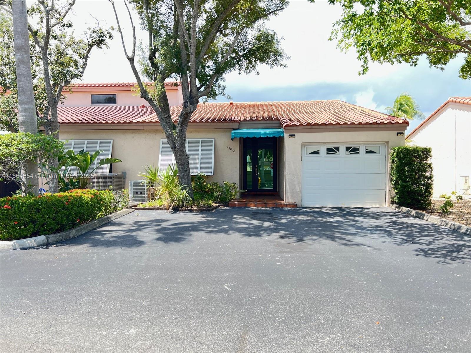 Exquisitely Remodeled Miami Lakes Corner Waterfront Villa With a 1 Car Garage! Fabulous Features Include the Following: Brand New Impact Doors and Windows, Tastefully Remodeled Kitchen & Bathrooms, Freshly Painted, Brand New Roof, Water & Fountain Views from the Kitchen, Living, Dining, & Primary Bedroom are Unbelievable! Washer & Dryer are Conveniently Located off of the Kitchen in the Laundry Closet... Relax & Enjoy the Large Patio Overlooking the Serene View, Go Kayaking, Paddle Boarding or Have a Weekend Bar-B-Que. The Entertainment Possibilities are Endless. There are Parks & Events, Fine Dining, Shops & Theatres @ Mainstreet, Plus More. All in Walking Distance or Just Use the Freebie Transportation App & they Will Take You There. Truly What Miami Lakes Living is All About!