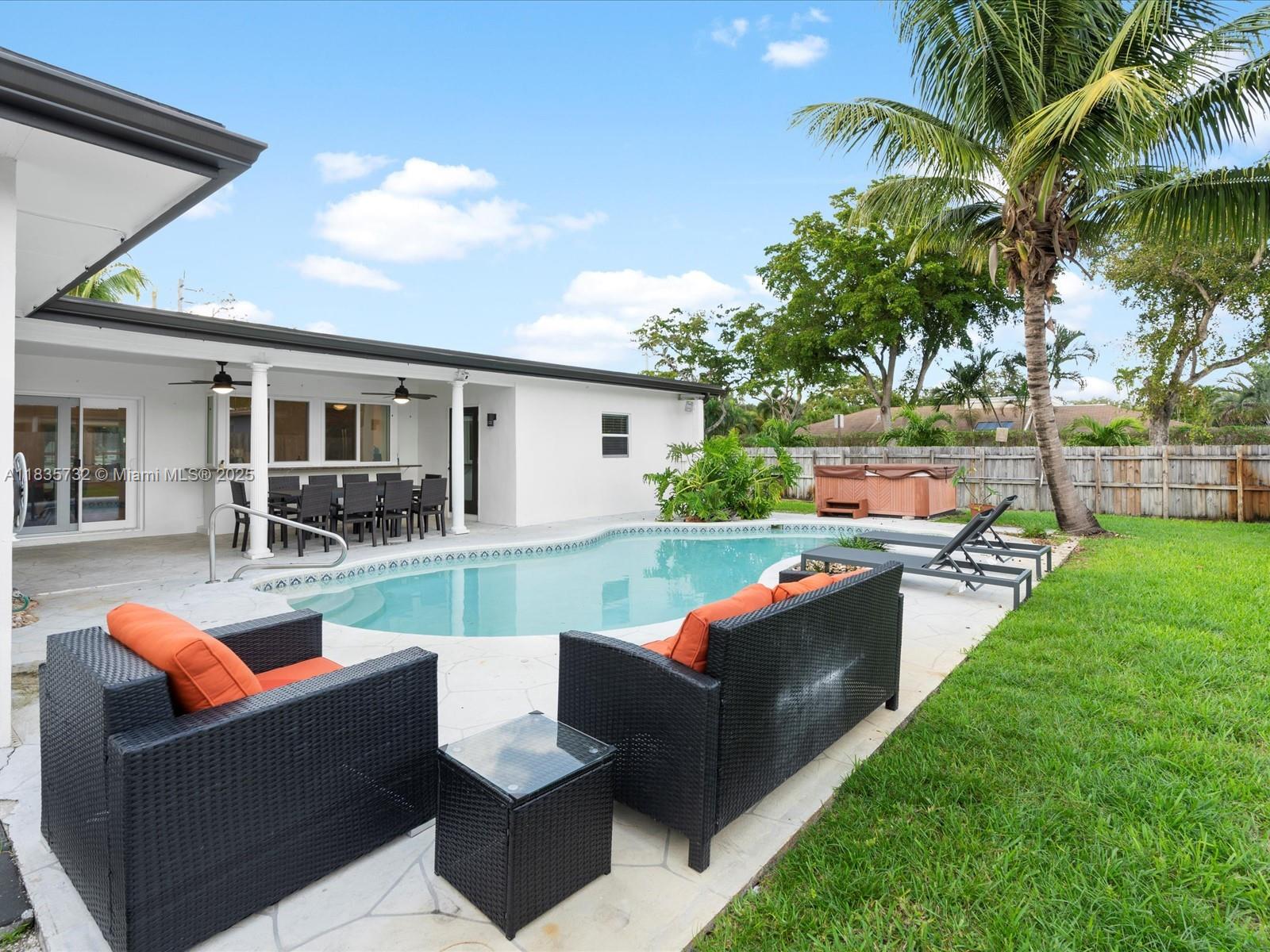 Discover your dream family home in the heart of Emerald Hills, one of Hollywood’s most sought-after neighborhoods. This updated 4-bedroom, 2-bathroom residence boasts an open-concept layout, seamlessly blending modern style and everyday comfort. Step outside to your private backyard oasis, featuring a spacious covered patio and refreshing with a large pool and jacuzzi—ideal for relaxation and entertaining. Inside, enjoy light-filled living spaces, kitchen overlooking the pool, and generously sized bedrooms designed for functional family living. Located just a short walk from several houses of worship and community parks, this home also offers quick access to I-95 and the Florida Turnpike. TEXT for Showings