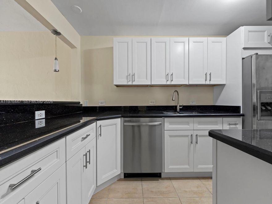 Excellent Location!! Walk to Metro Rail and Dadeland Mall. Pinecrest School district. Kitchen has been recently remodeled with modern shaker cabinets, granite tops and features stainless appliances. Both bathroom have frame-less shower doors, travertine shower and granite vanity. Water is included, W/D steps away. Enclosed screened balcony in a corner unit, community is gated and security guard, pool, pets allowed less than 15 lbs. VERY IMPORTANT 1 Parking Space ONLY. No Exceptions on Parking!