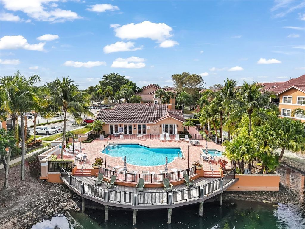 Photo of 8901 Wiles Rd #103, Coral Springs, FL 33067 (MLS # A11916033)