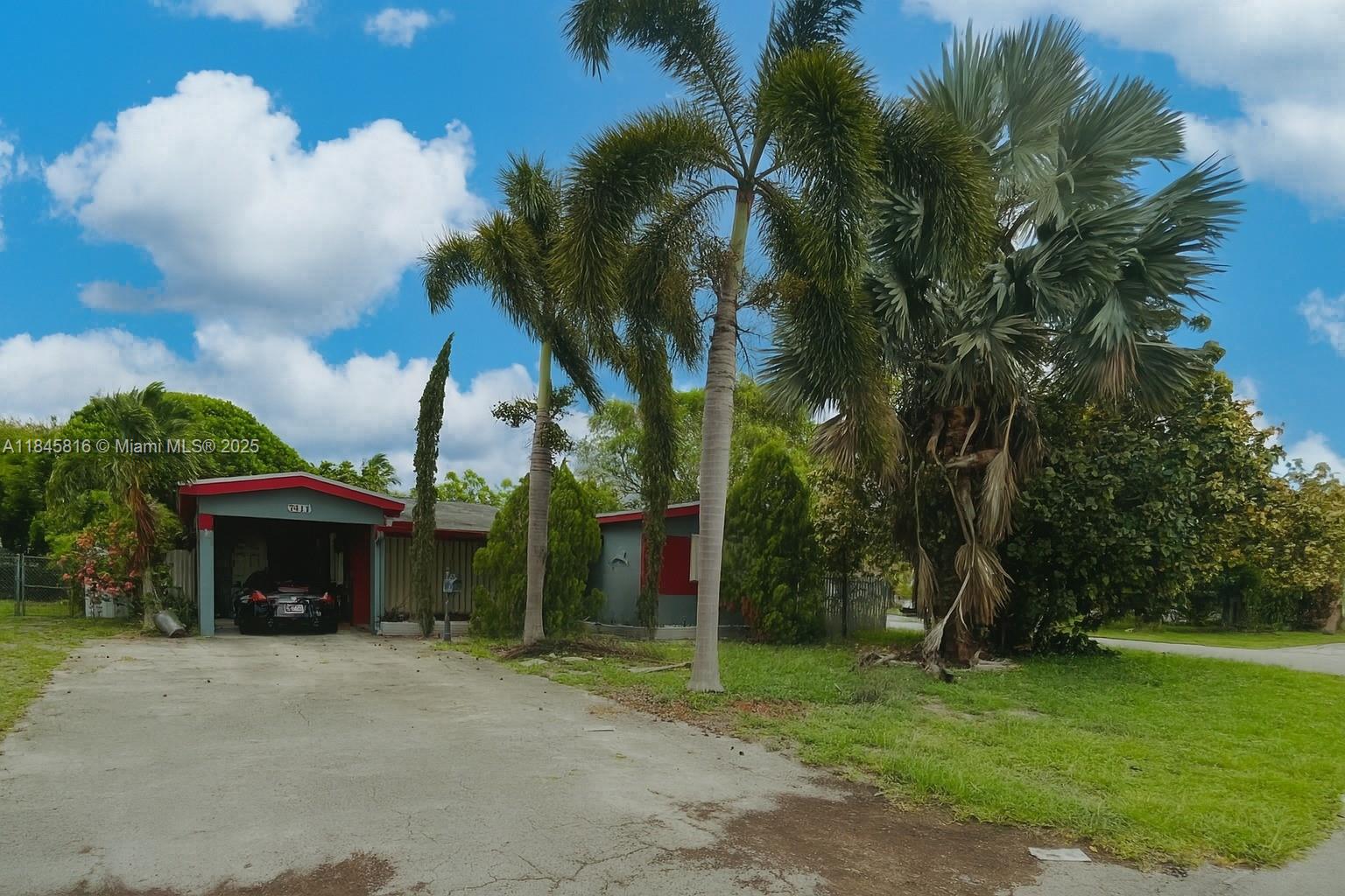 3 Bedroom/2 Bathroom home on a corner-lot plus an enclosed Florida Room. Large driveway with a carport. The roof is from 2016, and the home is equipped with hurricane shutters. Title throughout. Laundry room. Backyard boasts avocado and mango trees plus ample green space for pets, play, or future projects.