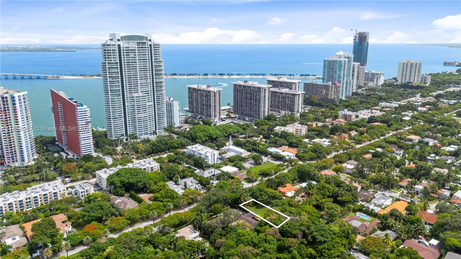 Experience ultra-luxury living on historic South Miami Ave with this rare 7,540 SF residential vacant lot, sold with approved plans for a stunning 4-level modern estate totaling over 13,000 SF. The residence spans to approximately 6,350 SF under A/C and features 6 bedrooms, 6.5 bathrooms, a study, library, and elevator with access into every floor of the home. Enjoy a rooftop oasis with pool (36’x9’) & summer kitchen, a 3,200 SF basement with private garage for 6 cars, and over 3,500 SF of terraces & outdoor living. A one-of-a-kind opportunity to build your dream home in the heart of Brickell. Crafted design is tailored for those who demand exclusivity and refinement. A rare chance to bring an exceptional vision to life in one of Miami’s most coveted locations.