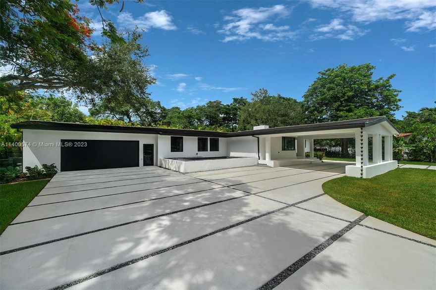 Completely renovated one-story estate in highly sought-after North Pinecrest. This elegantly remodeled home is move in ready and offers 4 bedrooms and 4 bathrooms plus home office/den. Discover a welcoming foyer entrance, large isolated formal living room with fireplace and an open and airy chef’s kitchen overlooking formal dining and pool. Spacious family room adjacent to a wonderful master suite with sitting area, large walk-in closet, and spa like bath with floating tub and shower. Additional Features include: infinity pool/spa, ample green grounds, impact windows and doors, porcelain tile throughout, cabana bath, and 2 car garage. Elite Pinecrest schools nearby