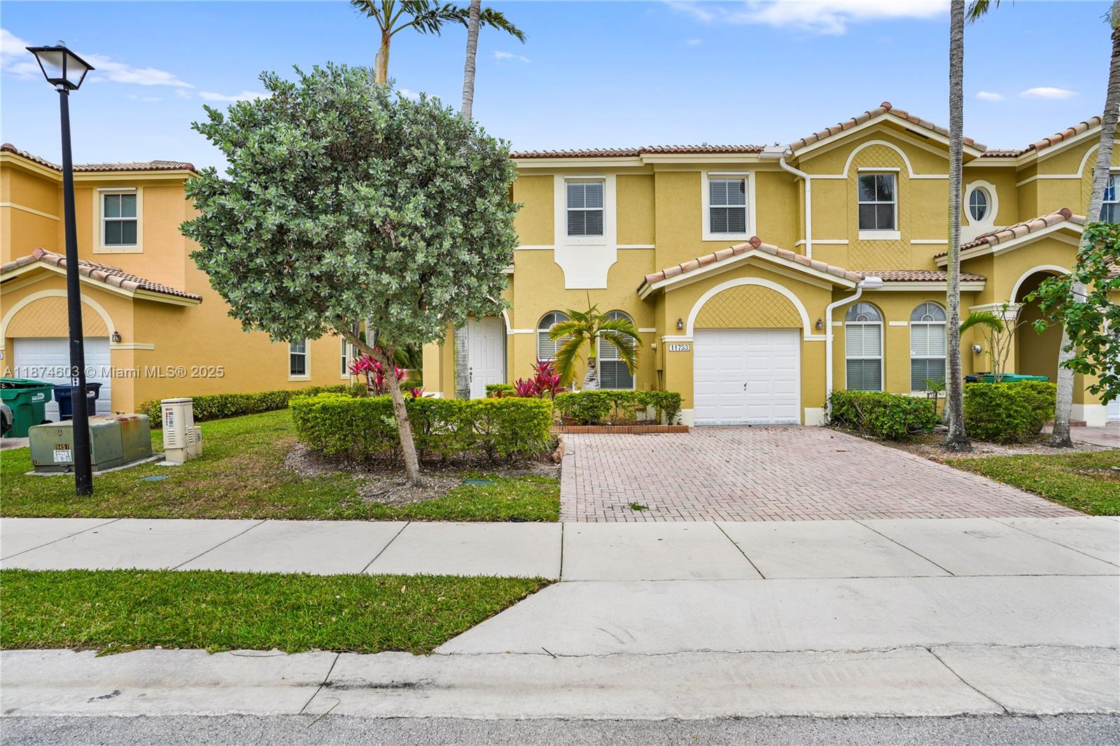 Welcome Home. This corner lot house features an ideal floor plan with 3 bedrooms and 2 bathrooms and a car garage that provides secure parking and additional storage. Renovations in this property have been completed recently. It has a new AC system, accordion shutters and much more. The Community offers many perks and amenities such as pools, gym and children's playground. Schedule the showing of this incredible townhouse today!!! It won't last.