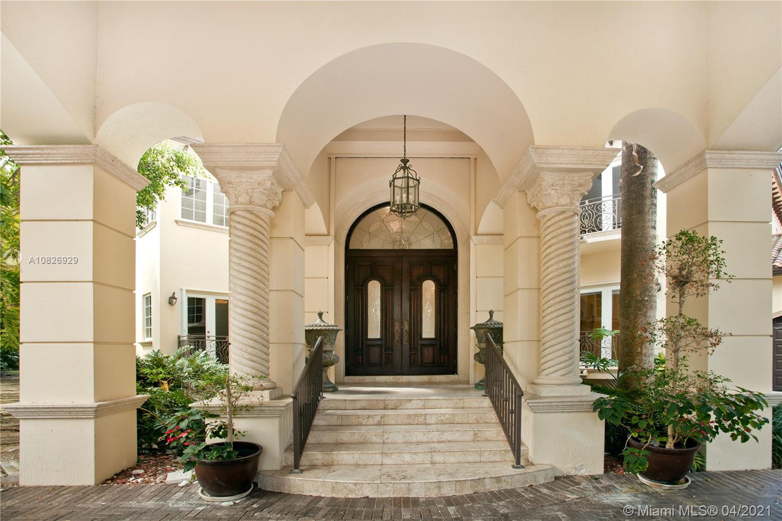 NEW PRICE! No bridges to Bay in Islands of Cocoplum. Gated for privacy on 20,862 sq ft lot on cul-de sac. Porte cochere & double door opening to foyer, high dome ceiling & winding staircase, elevator, formal living rm w/fireplace & formal dining rm. Family rm & large kitchen w/breakfast area. Across the living rm, there are a powder rm, studio/office, large guest suite, cabana bath. On 2nd floor, the private spacious main suite features 2 walk-in closets, 2 vanities, his & her water closets & large terrace. Bedrm wing features 3 en-suites & a den/office. The patio has a large covered terrace, pool & dock. Marble & hardwood floors. 3-car garage, Laundry rm, staff qrtrs. Impact windows and accordion shutters. AS-IS dock, needs work.