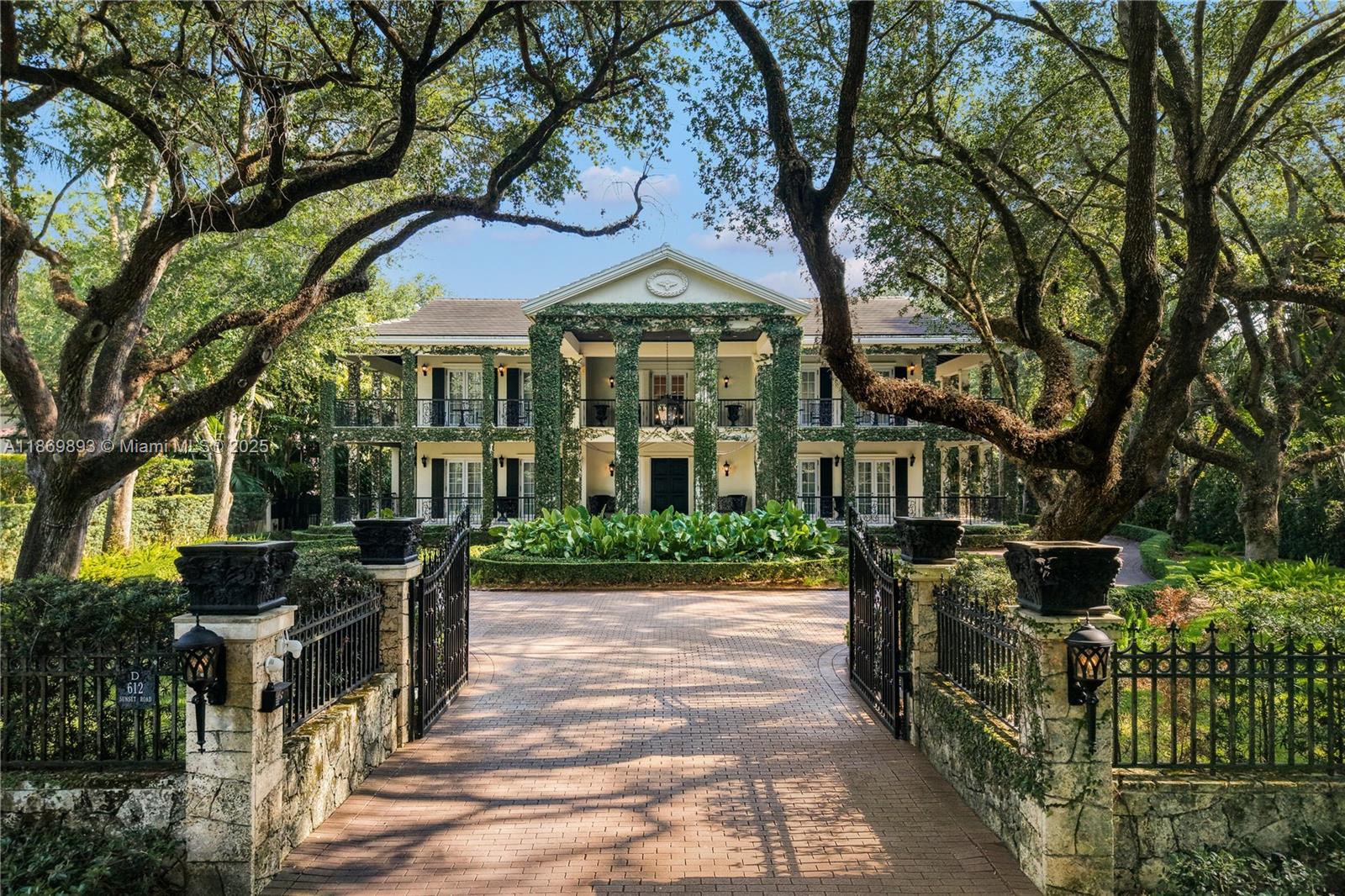 A once-in-a-lifetime opportunity to own this Plantation-style estate, never before on the market. Nestled on prestigious Sunset Road beneath majestic oaks & manicured ivy, this residence was constructed by a prominent builder alongside Corwil Architects to stand the test of time. A coral stone entrance, motorized gates, circular Chicago brick driveway, & a porte cochere set the tone for grand living. Features include a generator with automatic transfer switch, dual underground gas tanks, dual septic systems, La Finestra exterior French doors with five-point locking system, & a full re-roof. Interiors boast mahogany wood floors, solid mahogany doors w/ brass hardware, a 3-car garage, and an air-conditioned attic spanning 1,000 SF. A rare estate of timeless elegance & enduring quality.