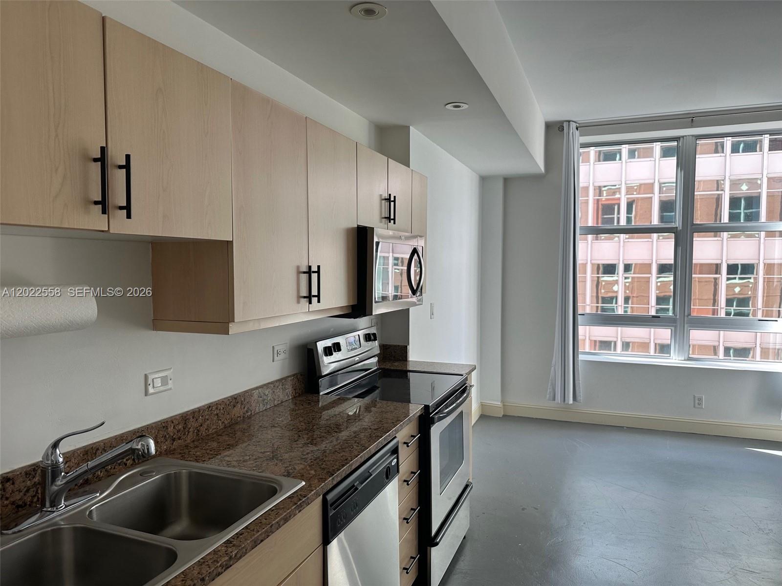 111 E Flagler 702