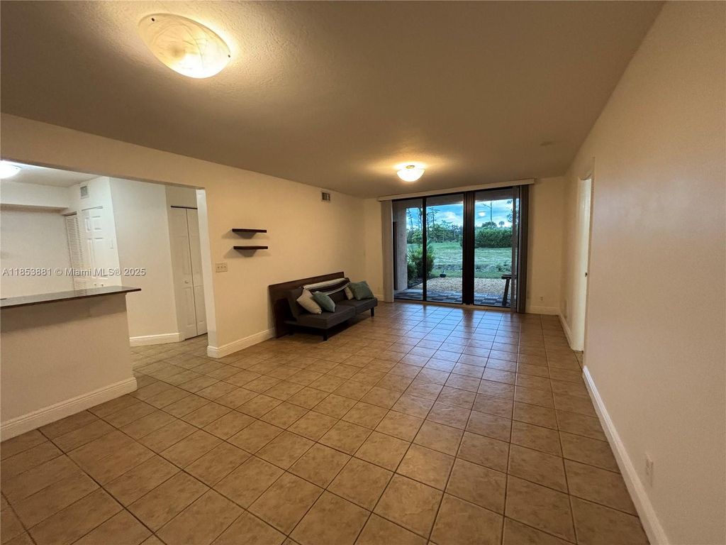 Photo of 5761 Riverside Dr #105B4, Coral Springs, FL 33067 (MLS # A11853881)