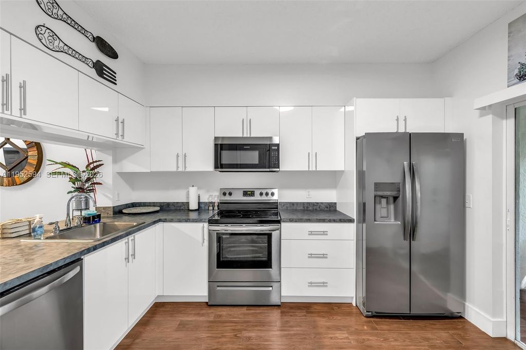 Photo of 3340 Confetti Ln #79-9, Margate, FL 33063 (MLS # A11952594)