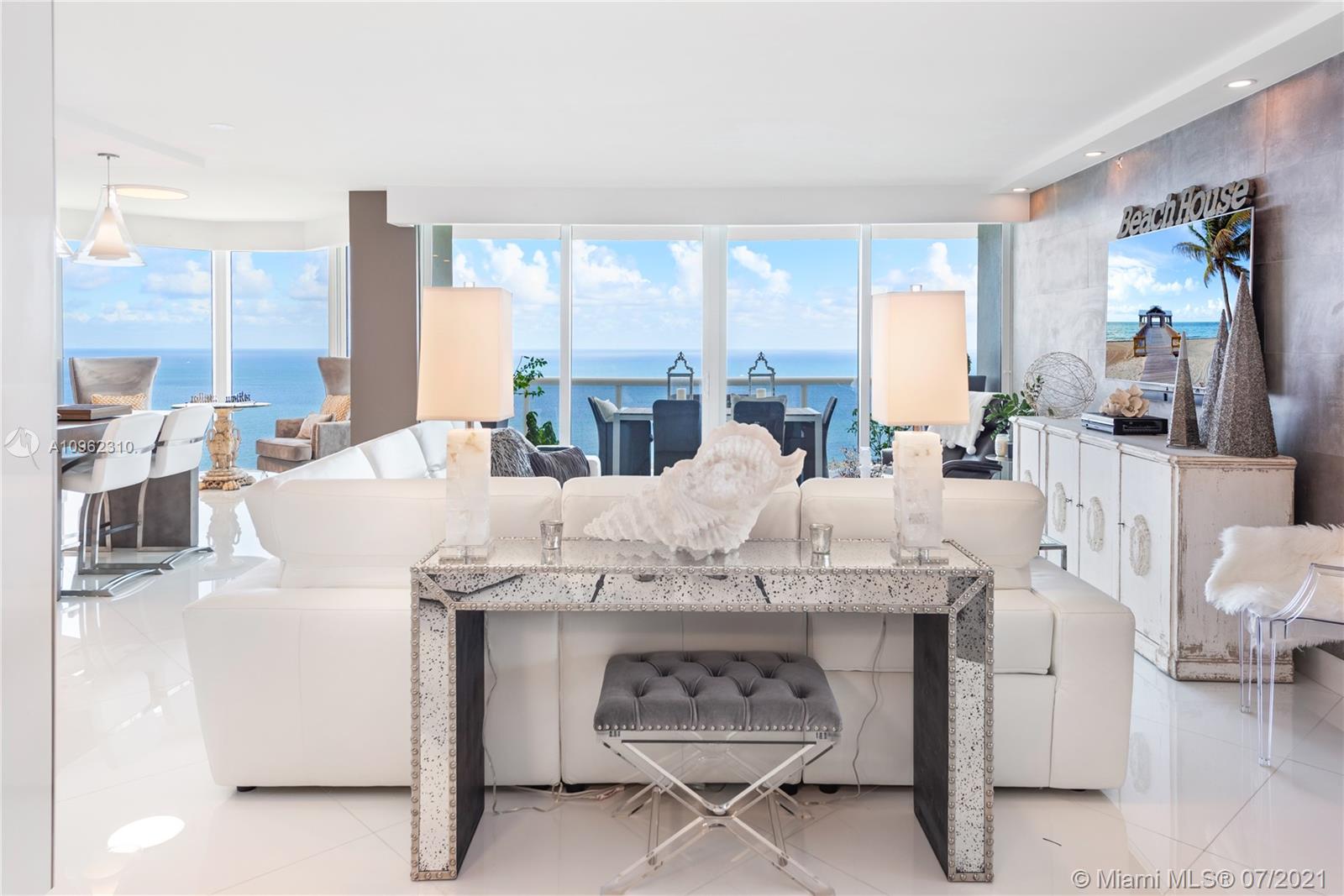 Impeccably designed residence. Two premier oceanfront units are combined to create a palatial-size space. Breathtaking views of the ocean, bay and city. No expense has been spared in every detail of this residence, soaring high above the shimmering ocean. Three bedrooms, 5 bathrooms plus a spacious den. Highlights: Double door entry, large living and dining room areas; floor-to-ceiling windows; electric shades; custom lighting; gorgeous flooring throughout. Two large large suites, custom built walk-in closets and custom designed baths. European style open kitchen. Enjoy luxury beachfront living with five-star resort-style amenities and services. Unit comes with 3 parking spaces.