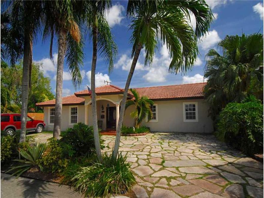 Beautifully updated 1-story home w/heated pool. Ceramic floors thru-out, new eat-in kitchen w/stainless steel appliances & granite countertops, new baths, laundry room has full-size washer & dryer, spacious family room, alarm & cameras, paved driveway for  5 cars, hurricane shutters, shed, gazebo & BBQ area. 4th bdrm is adjacent to home, used as office. Yard and pool maintenance included in rent! Enjoy living in an excellent location! This property is in NO financial distress. Available 9/15/2015.