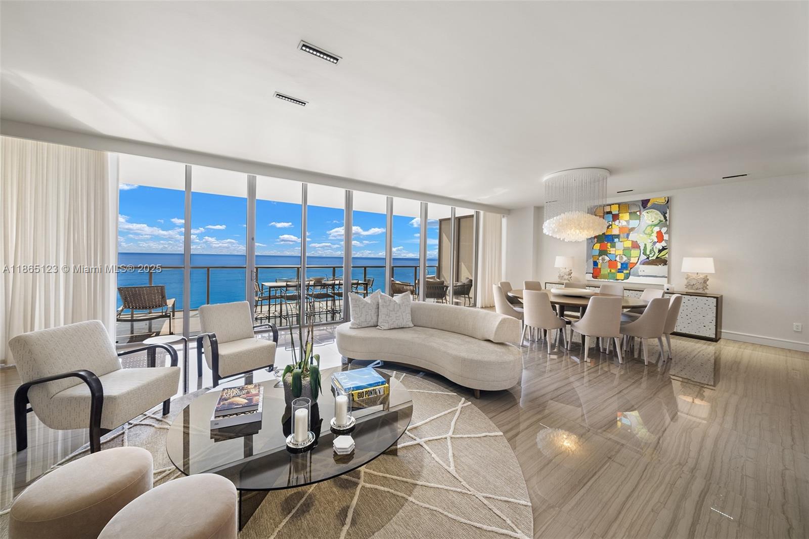 Nestled in the heart of Bal Harbour, St Regis rises from the turquoise waters of the Atlantic along its white sand beaches in the city’s most coveted location. One of only seven “Mayfair” units in the tower, the layout features an impressive 47' of ocean frontage with living, dining and a family room in addition to a city-side den. Fully customized with luxury appointments including marble and hardwood floors, a chef's kitchen, wardrobes and decorative elements all by Poliform, lavish onyx baths, and smart home automation. With a nearly 4000sf interior and 1250sf of outdoor space overlooking the ocean, intracoastal and downtown-skyline, the residence is ideal for families and entertaining. 5-Star amenities and services with on-site dining and the Bal Harbour Shops outside your front door!