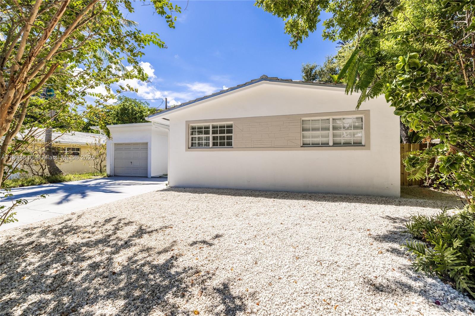 Welcome to Maison Dominique! You’ll feel like you’re on a magical journey as you approach this home down Historic Bayside’s most enchanting, narrow, tree-lined street. This classic mid-century modern delight begins with dazzling terrazzo floors, bright open living that opens to a sun-drenched Florida room, and spacious kitchen and dining-- all window-wrapped overlooking and opening to the carefree, easy-maintenance private garden-style patio and gardens—great space for entertaining and relaxing. Unwind in three bedrooms and two updated baths! Rest easy with impact windows. Did we mention the one car garage? All in a great location in the heart of the MiMo District, near Baywood Park, shops and restaurants, Legion Park Farmers Market, and more. C’est magnifique!