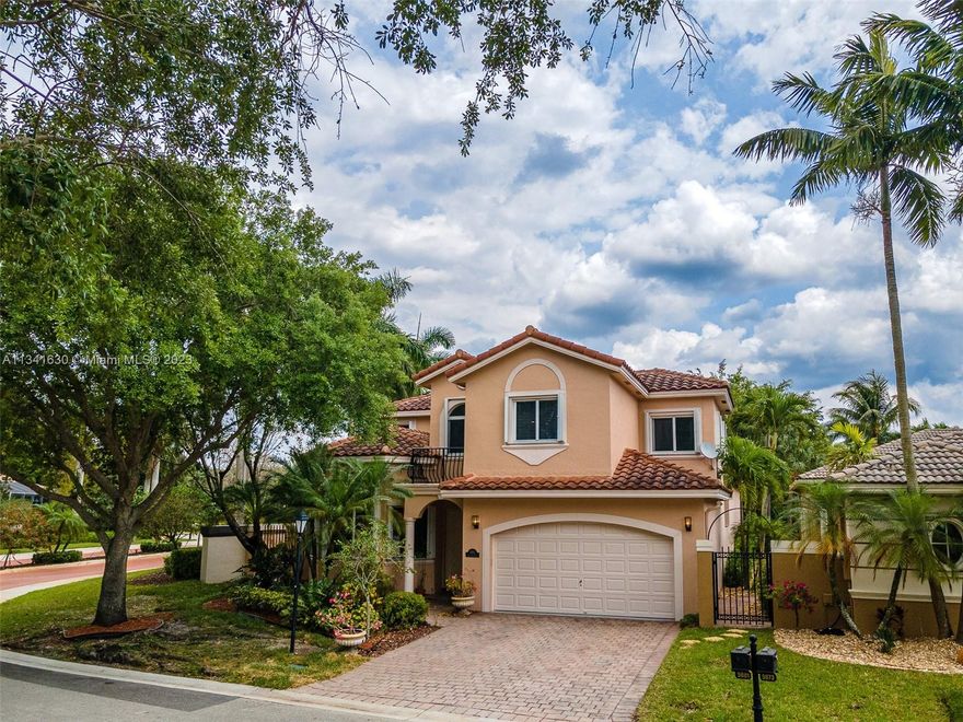 Highly sought-after Mizner Village@Heron Bay, Parkland living with low Coral Springs taxes! Zoned for Parkland schools! A+ School District! This 4/3 elegant & bright corner lot home features a 1st-floor master bedroom with wood floors, remodeled master bath with dual vanities, and a roman tub. Also, a 1st-floor Guest room with ceramic flooring & full bath, 2 big bedrooms & 1 full bath upstairs. Tile floors in living areas, updated kitchen w/real wood cabinets & granite. The entire home has been freshly painted, w/ accordion shutters, and a 2-car garage with epoxy floor. Beautiful +2,000sqf garden with additional patio and fenced yard. The community boasts 2 resort-style clubhouses, kids splash pad, tennis courts, and racquetball courts. Home features:2014 ROOF, 2022 A/C, 2015 water heater.