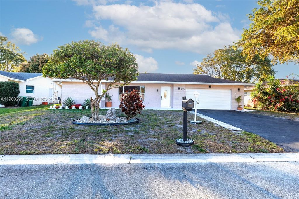 Photo of 8209 NW 91st Ave, Tamarac, FL 33321 (MLS # A11980295)