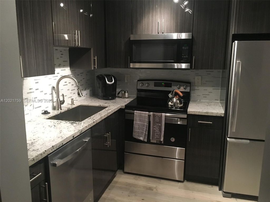 Photo of 9440 SW 8th St #320, Boca Raton, FL 33428 (MLS # A12021759)
