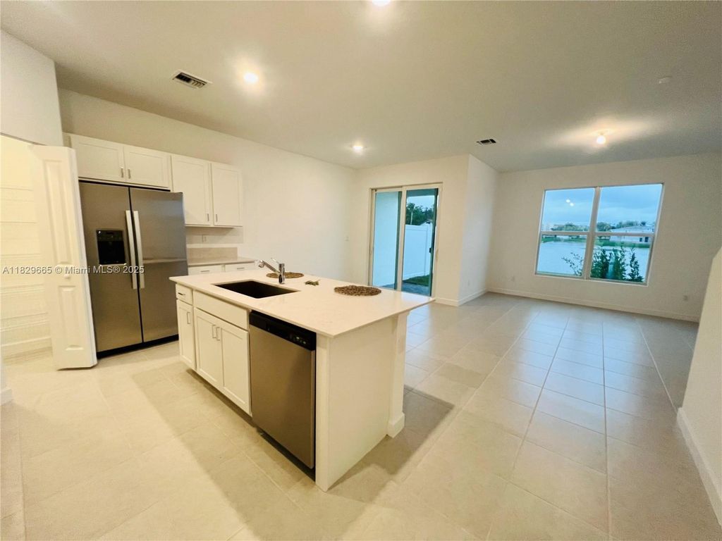 Photo of 6935 Harbours Edge Ave, Lake Worth, FL 33467 (MLS # A11829665)