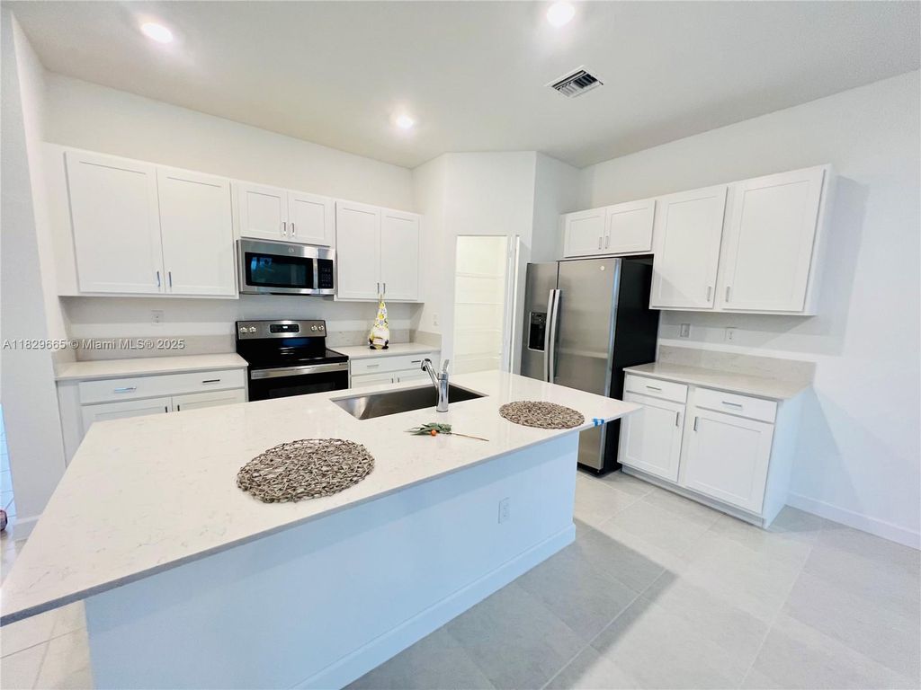 Photo of 6935 Harbours Edge Ave, Lake Worth, FL 33467 (MLS # A11829665)