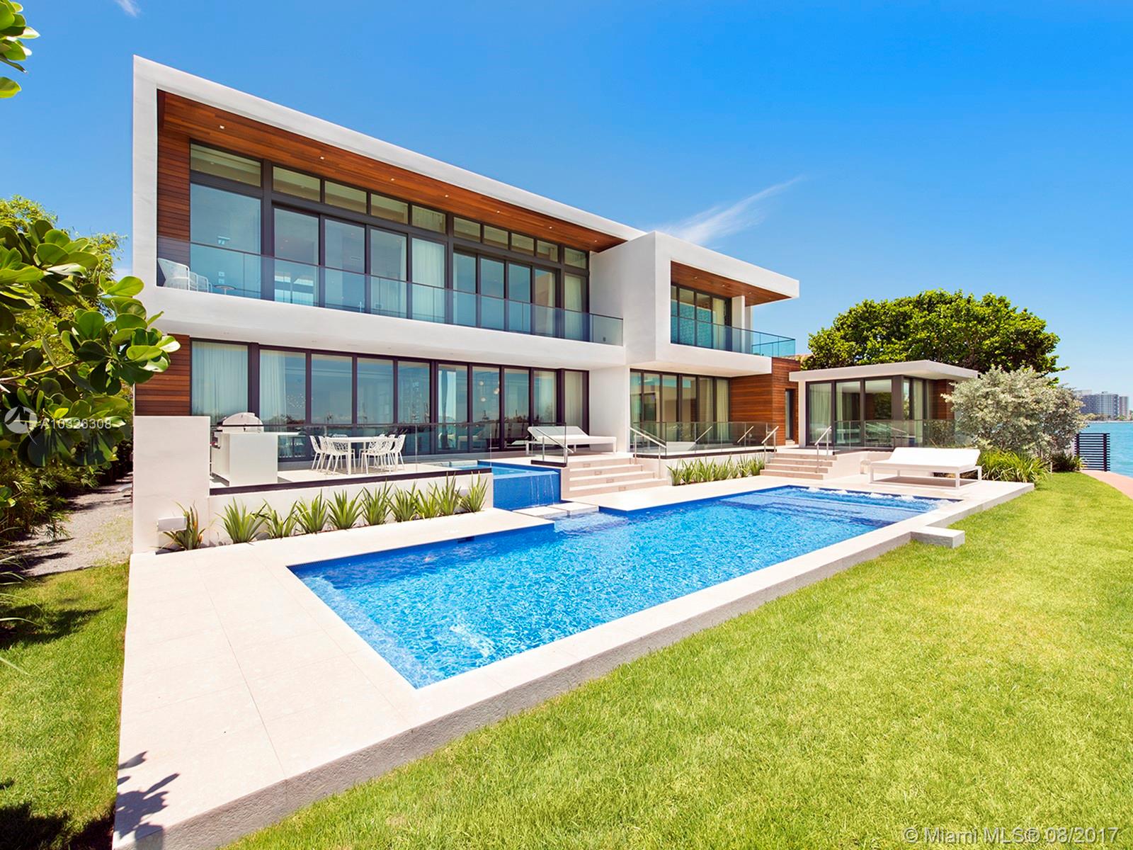 New modern waterfront home on Venetian Islands in Miami Beach, boasts 5 beds, 7.5 baths plus office and spa. Lavish 7,026 sf with the finest finishes. Stunning custom Boffi kitchen touts double Subzero and Miele appliances. Ornare closets, elliptical staircase illuminated by a 300 sf skylight, cerused oak floors throughout, glass elevator, Savant Smart Home with 4 car garage with electric lifts. Venture outdoors and uncover a resort-style backyard with 107 ft of water frontage, no luxury spared.