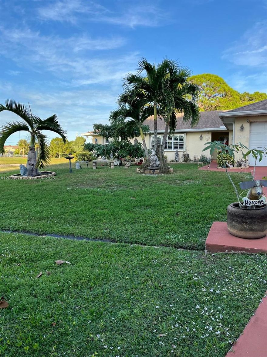 Welcome to your private sanctuary in Port St. Lucie! This stunning CBS home offers a unique 4BR/3BA layout  featuring a professional garage conversion perfect as an in-law suite or rental opportunity with its own private bathroom and separate entrance. Major upgrades provide total peace of mind, including a Brand New Roof and Gutters (2024) and a New A/C (2025). The home is fortified with accordion shutters and partial impact windows, while the interior shines with updated bathrooms, plantation shutters, and a modern kitchen featuring new stainless steel appliances.  The outdoor living space is a true tropical escape. Relax on the enclosed terrace and take in serene lake views. The fully fenced backyard includes a gate for direct lake access and a large, brand-new stainless steel shed for ample storage. Nature lovers will appreciate the absolute privacy of a wooded preserve located both in front of and behind the property and the beautiful lake views that always bring in all kinds of birds and animal life. Harvest your own fruit from the mature banana and avocado tree, all set against a backdrop of towering pine trees.  With no HOA and a versatile layout, this property is perfect for multi-generational living or savvy investors. Schedule your showing today!