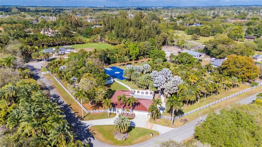 Experience the pinnacle of luxury living in the heart of prestigious Southwest Ranches. Nestled behind a breathtaking landscape of towering full-size palm trees, this extraordinary 5-bedroom, 3-bathroom estate sits on over 2 private acres, offering an unmatched blend of elegance, tranquility, and resort-style living. The property captivates with its grand presence, lush tropical surroundings, and newly installed barrel tile roof that perfectly complements the estate’s timeless architecture. Inside, the residence features expansive living spaces filled with natural light, spacious bedrooms designed for comfort, and an inviting floor plan ideal for both everyday living and upscale entertaining. Impact windows and doors have also been installed throughout the entire home. The gourmet-style kitchen opens seamlessly into generous gathering areas, creating the perfect atmosphere for hosting family and guests. Every space throughout the home has been thoughtfully designed to embrace the beauty of the outdoors while maintaining a warm and luxurious ambiance. Step outside into your own private paradise. The spectacular backyard retreat showcases a sparkling resort-style pool serene lagoon full basketball court and an impressive covered outdoor kitchen and entertainment pavilion designed for unforgettable gatherings year-round. Surrounded by mature tropical landscaping and endless open space this estate offers the ultimate in privacy and relaxation 

APPRAISAL REPORT ATTACHED!