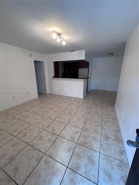 Photo of 6040 Shakerwood Cir #203, Tamarac, FL 33319 (MLS # A11878298)