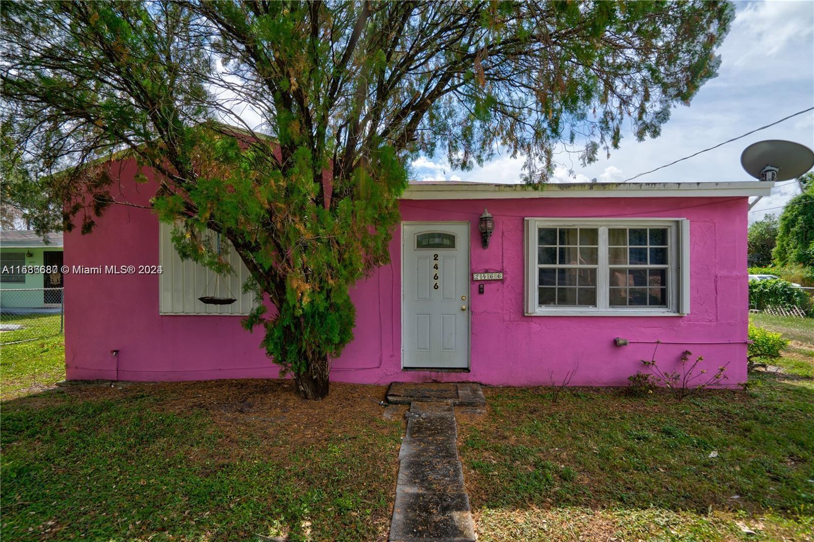 Charming in Pink: Discover serenity in this adorable 2-bed, 1-bath haven nestled at 2466 NW 96th St, Miami. A 960 sq ft single-family gem with an oversized backyard, offering plenty of room for a garden, boat, or RV. Your dream home awaits! Property sold-as-is; Washer and Dryer Not Included in the Sale. Probate Sale. No disclosures to be provided regarding the property.Charming Pink House with an oversized backyard.