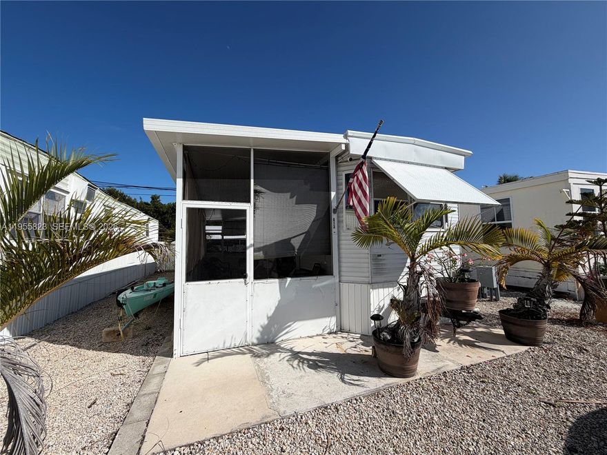 Looking to find an inexpensive way to enjoy the relaxed, Florida Keys living? Take a look at this well-maintained 2004 Skyline 39' trailer located on a leased lot in a quiet 55+ community in Marathon, Florida. This cozy home offers two bedrooms and one bathroom with a shower, making it ideal for full-time living or a seasonal retreat. The interior features a functional floor plan with comfortable living space, natural light, and easy-care finishes. The kitchen and living areas are efficient and inviting, perfect for simple island living. Bedrooms are thoughtfully sized to maximize comfort and storage. A screened in patio and outdoor area for simple entertaining and outdoor delight. Conveniently located near shopping, dining, beaches, and all the Florida Keys have to offer. A great opportunity for affordable Keys living in an age-restricted community.
Lease details: No real estate to convey. Annual land lease is paid in January, currently approximately $1,200 per month (subject to change). Buyer to pay prorated balance at closing. New owner approval is required and includes passing a background check. Community amenities include access to a coin-operated laundry facility. No rentals allowed and buyer responsible for registration with Monroe County. Buyer to verify Galway Bay community rules and regulations to satisfaction.