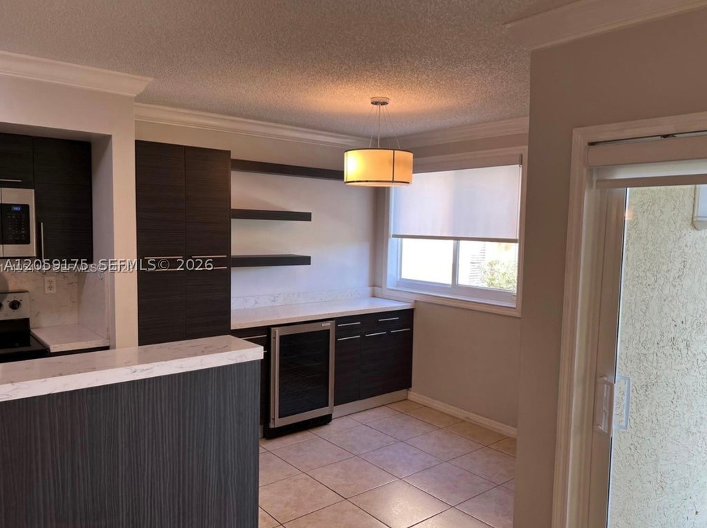 Photo of 2600 S University Dr #114, Davie, FL 33328 (MLS # A12059175)