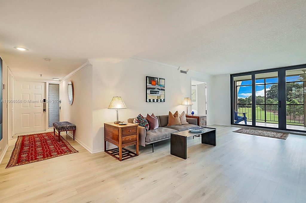 Photo of 5390 Woodland Lakes Dr #301, Palm Beach Gardens, FL 33418 (MLS # A11908558)