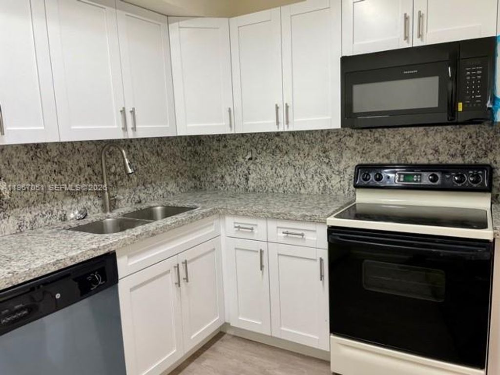 Photo of 1754 NW 55th Ave #102, Lauderhill, FL 33313 (MLS # A11967051)
