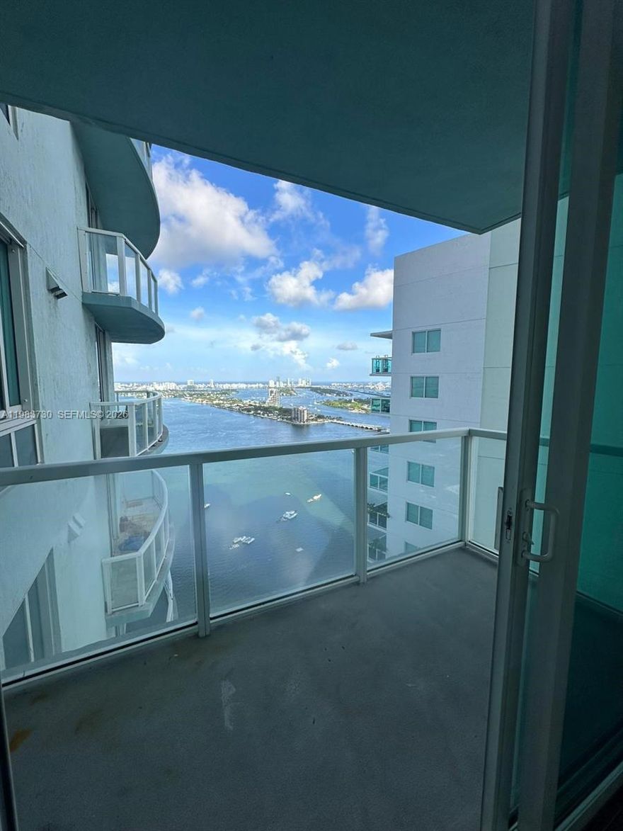Location, Location, Location. Stunning open bay views from this bayfront condo in the heart of Edgewater with soaring 14–16 ft ceilings. an open kitchen, wood floors throughout, a new custom closet, shower glass doors, and lamps. 
Located across from Margaret Pace Park and minutes from Wynwood, Midtown, Design District, Downtown, Brickell, Kaseya Center, museums, dining, and the beach, with easy access to I-95 via 395 or 195. Comes with one assigned parking space, under the building, and valet parking is available
Full-service luxury building with 2 pools, a state-of-the-art fitness center, steam and sauna, social rooms, a theater, and 24-hour concierge.